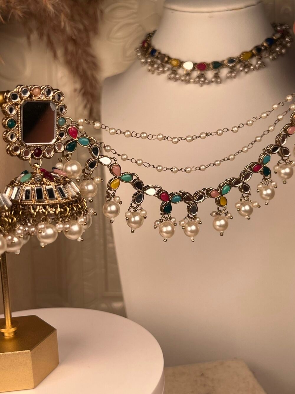 Multi-Stone Mirror-Worked Necklace Set – South Asian jewelry – Bridal accessory Multi-Stone Mirror-Worked Necklace Set – South Asian jewelry – Front view Kundan & Mirror Necklace Set – South Asian jewelry – Side angle Kundan & Mirror Necklace Set – South Asian jewelry – Top view Designer Floral Mirror-Worked Necklace Set